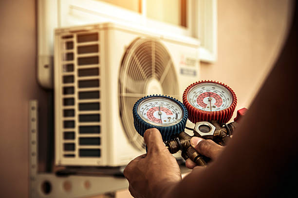 Professional Heat Pump Repair technician working in Hooper, UT